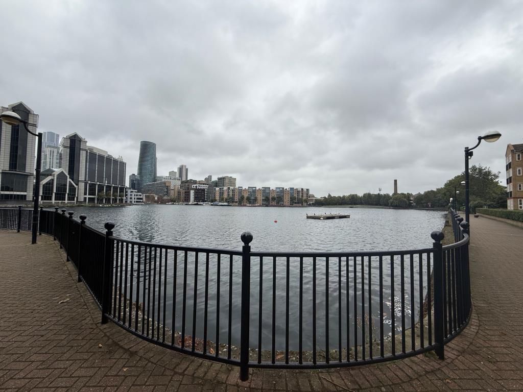 Lot: 179 - TWO-BEDROOM FLAT IN NEED OF IMPROVEMENT - View of Dock from street behind the block